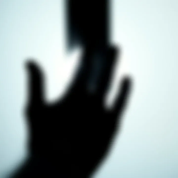 Hand silhouette in shadow Silhouette of a hand with an absence in the center, set against a light background, representing the concept of a missing hand