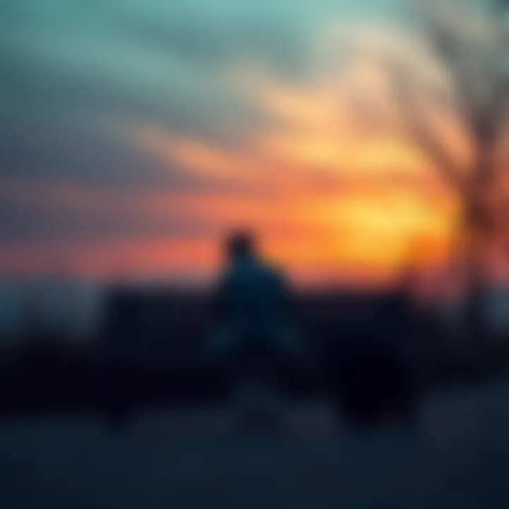 A person sitting on a bench with their head down, showing signs of sadness and reflection after a breakup.