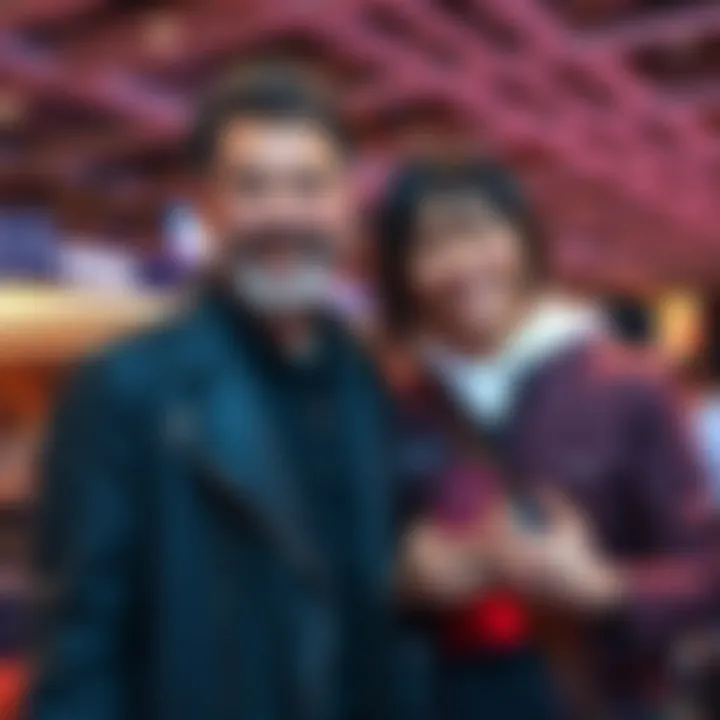 Voice actors Keith Silverstein and Nozomu Sasaki pose together, smiling at a fan event, capturing their joyful moment.