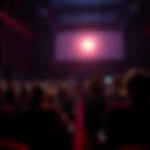 Audience seated in a dark theater, focused on the screen while a phone light disrupts the experience