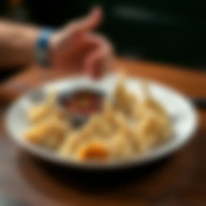 A plate of momos with a person giving a thumbs down gesture nearby, showing disapproval of the dish.