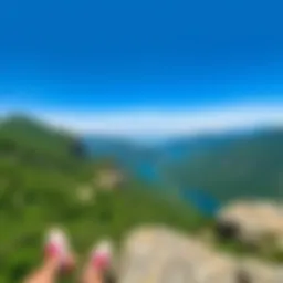 A panoramic view of Holy Peak showing lush greenery, rocky slopes, and a clear blue sky, perfect for outdoor activities.