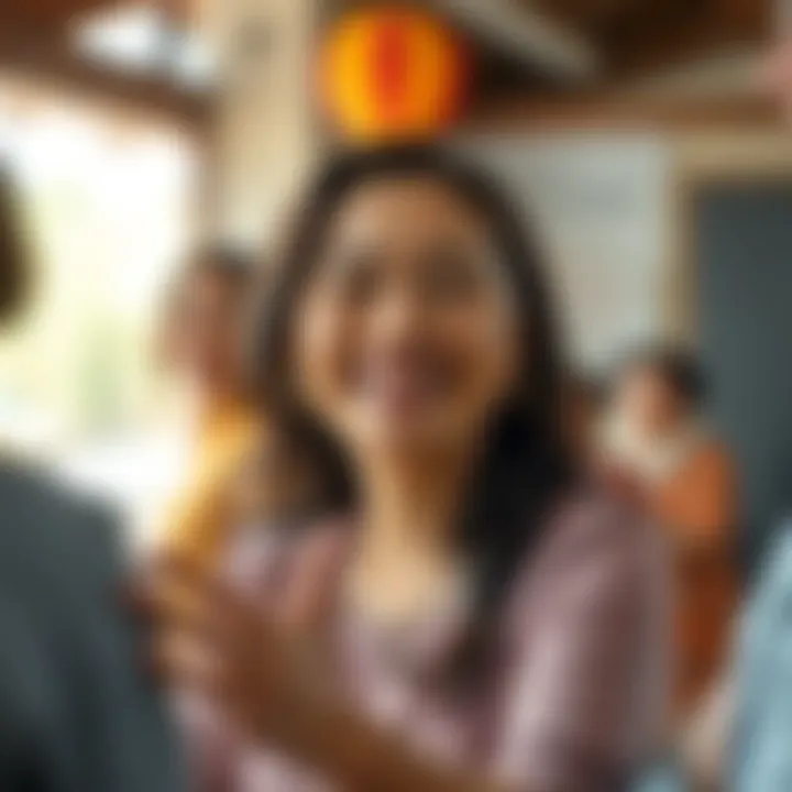 A woman smiling warmly, interacting with a group of people in a community setting, showcasing her role as a supportive figure.