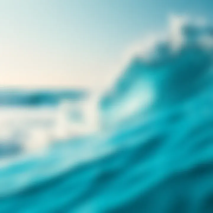 Bright blue waves crash against a sandy beach under clear skies